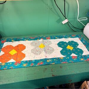 Vibrant Floral Table Runner with Teal and Orange Accents